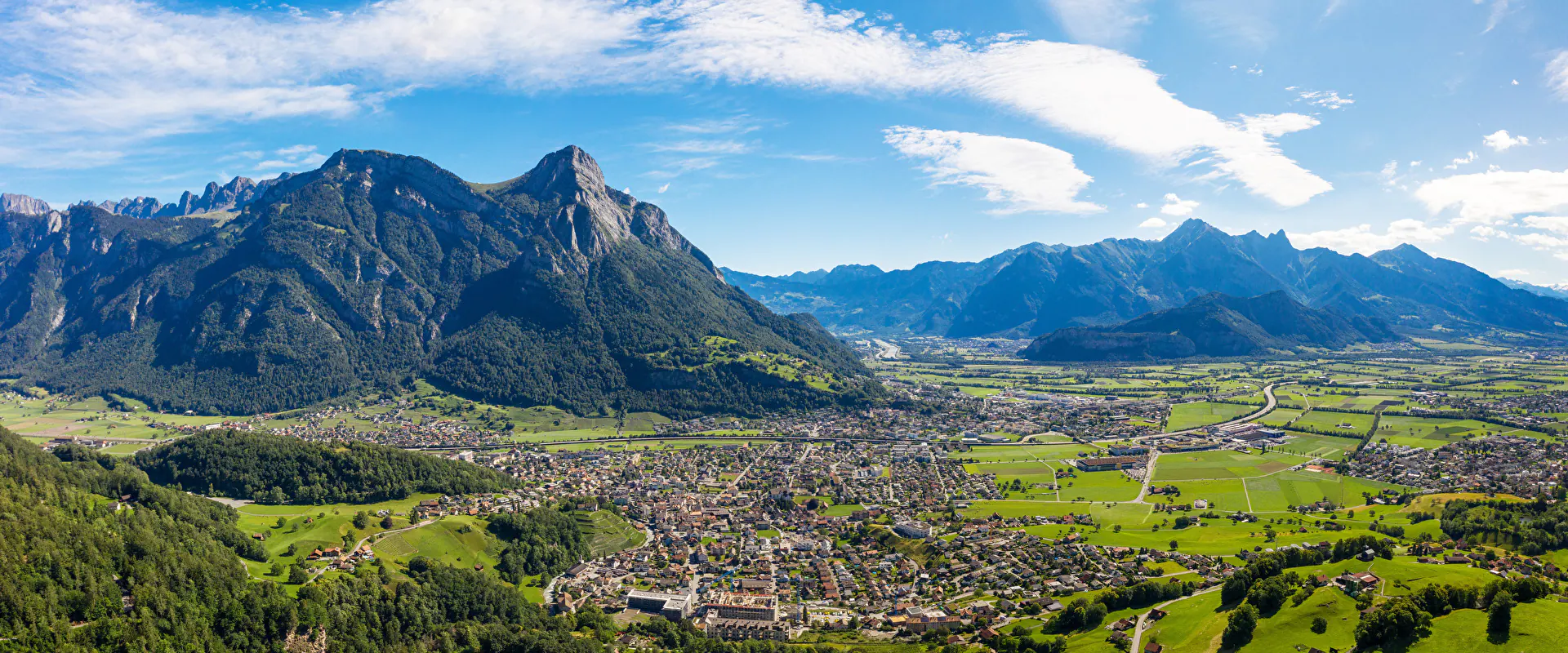 Panoramic view over Mels, Switzerland, and the surrounding Alps